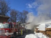 Fire at a wood-and-metal fabrication studio forces evacuation; no injuries reported